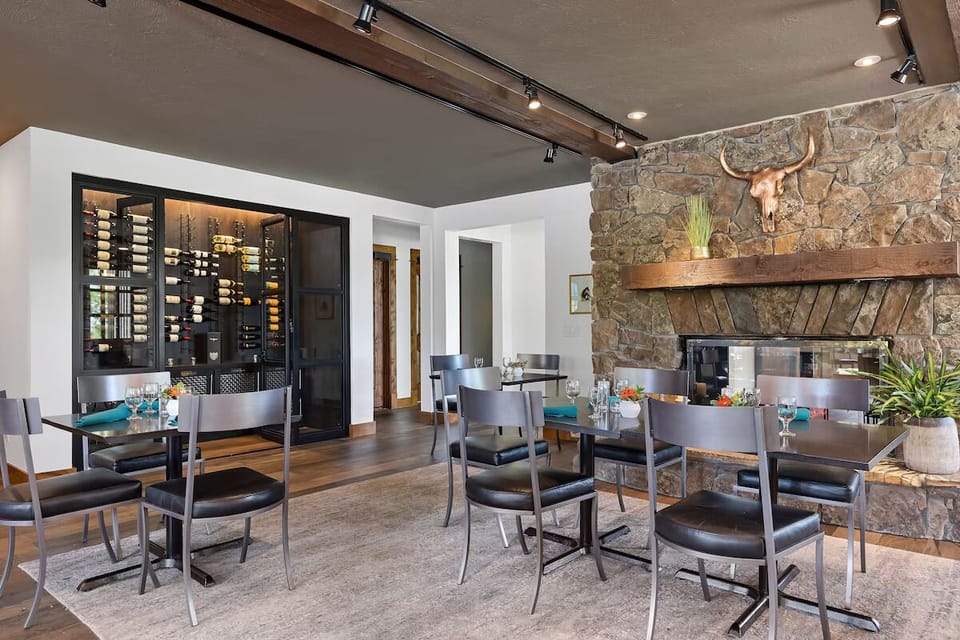 Gather by the stone fireplace for cozy après-dinner warmth.