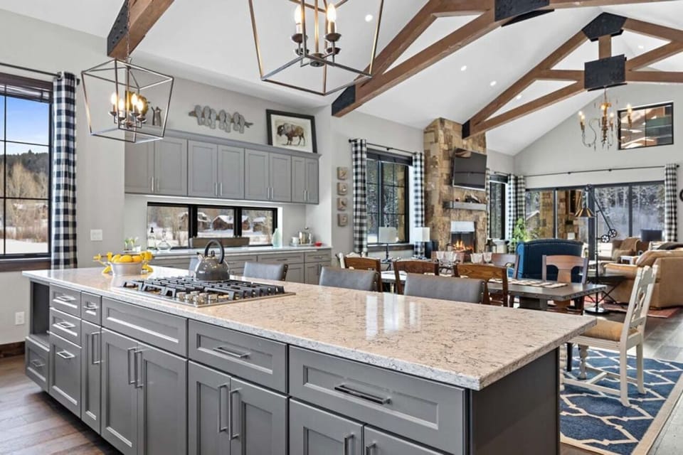 Entertain together in a soaring great room with mountain views.