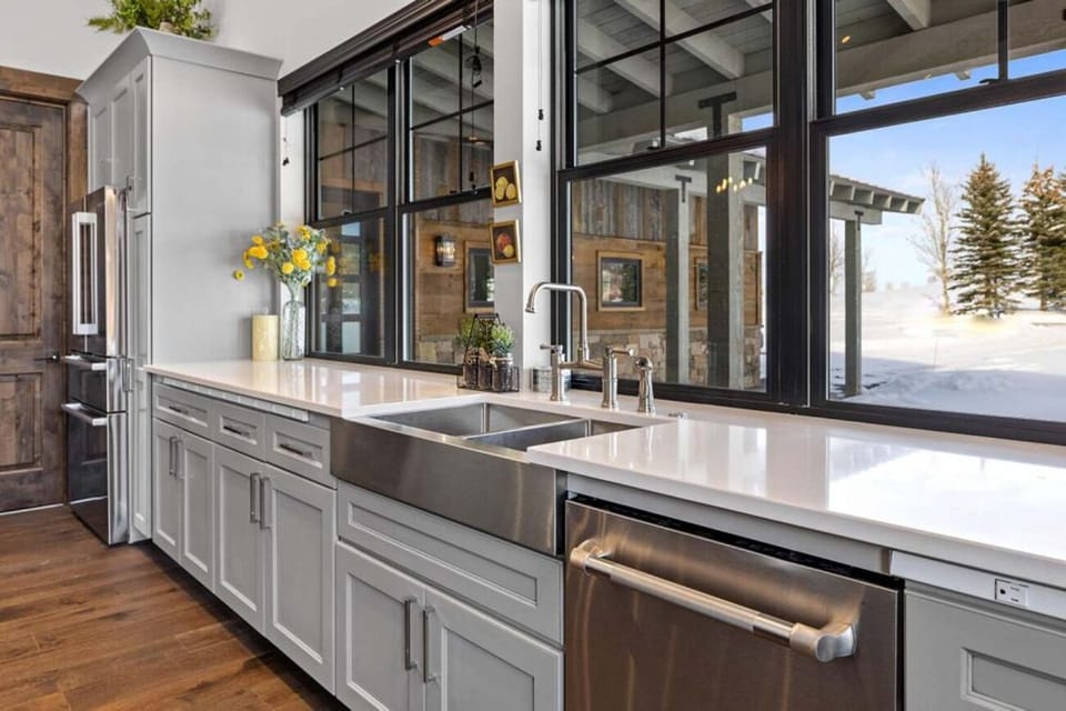 Savor sunny mornings at the farmhouse sink with snowy vistas.