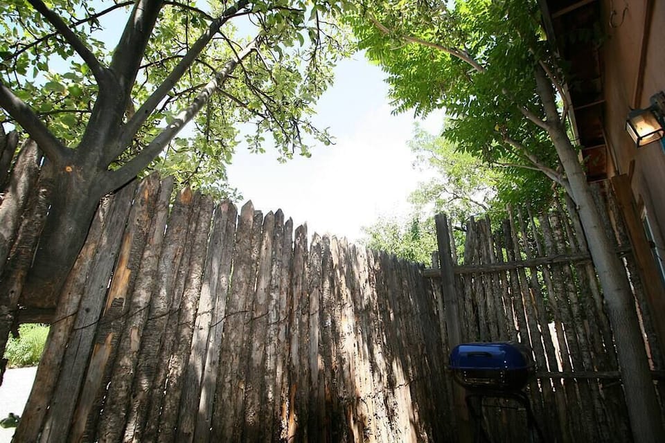 Back courtyard with BBQ grill and seating for 2
