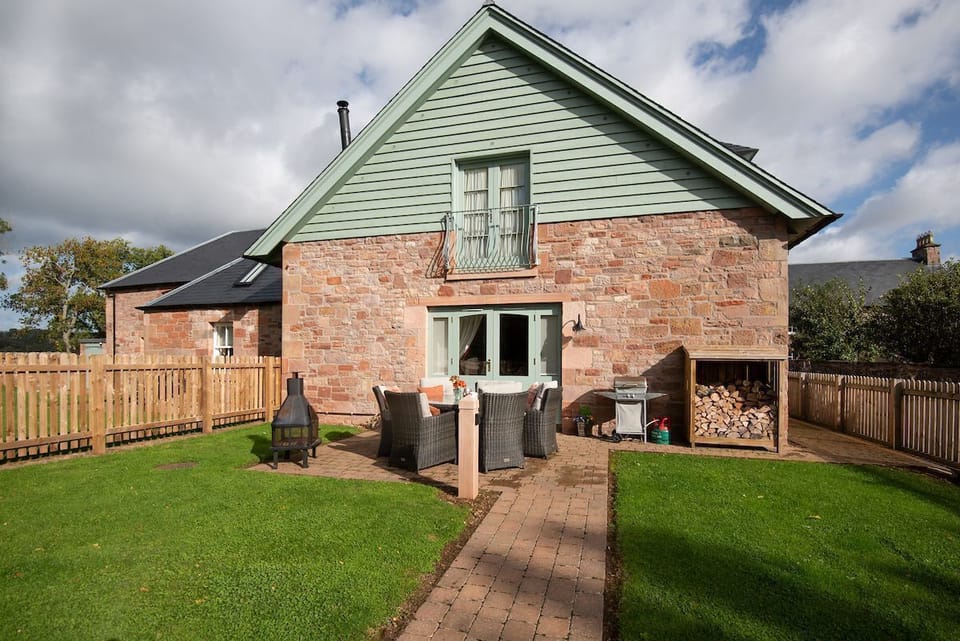 Dryburgh Steading Four - outside seating area with lawned garden