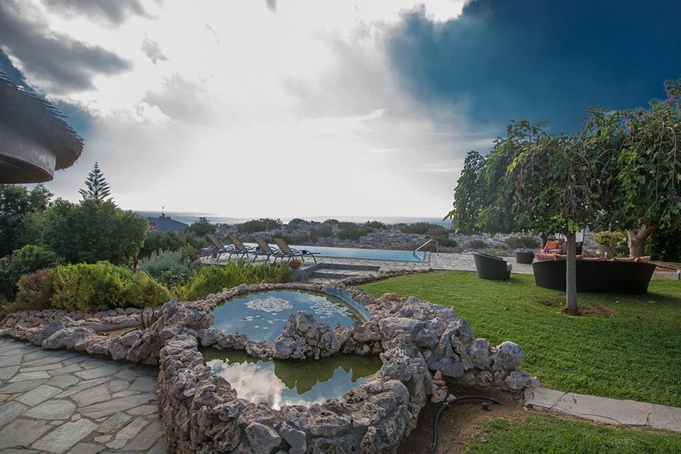 Sizeable garden with barbecue, seating and dining area, sunloungers and Pool