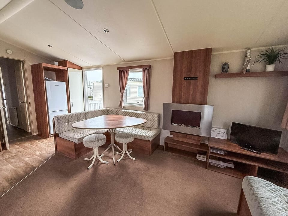 Cozy living and dining area with natural light and modern comfort