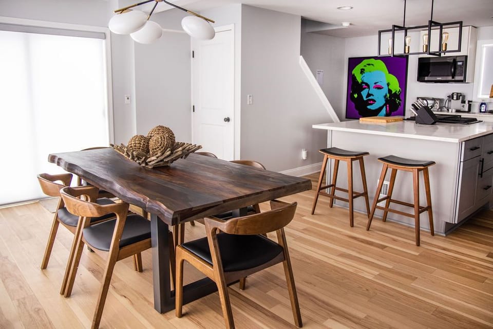 Live Edge dining table with seating for 6.  Spill over seating for 6 outside!