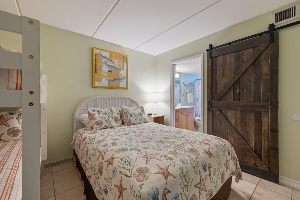 The combination of a full bed and bunk beds offers plenty of room to unwind.