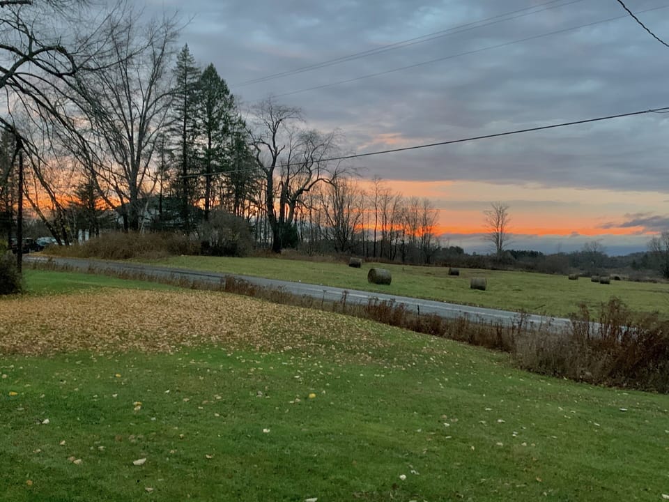 Sunset view of the farm fields across the street