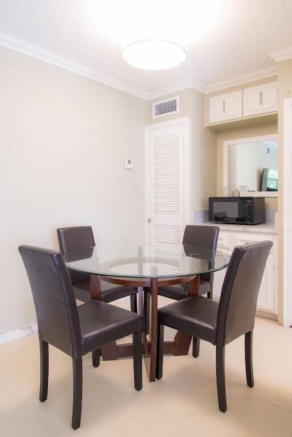 Dining room table comfortably seats 4 guests