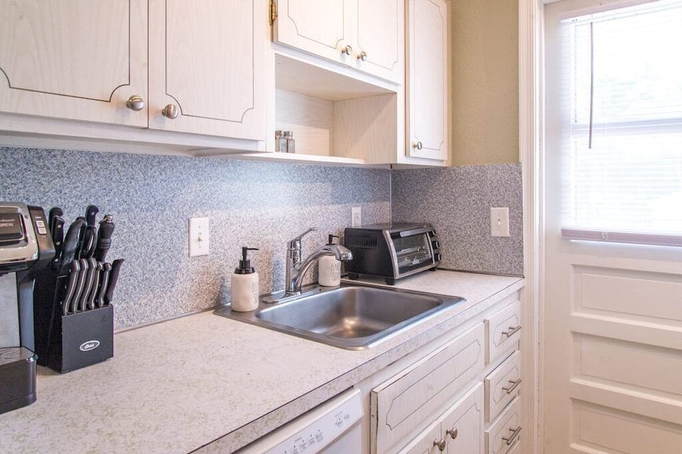 Kitchen also includes knife block, pod coffee maker and toaster oven