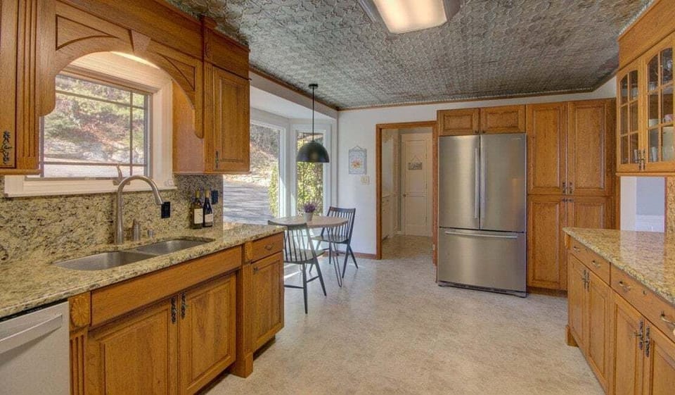 The roomy kitchen has lots of counter space, dual sinks and all the cookware and dishes you'll need.