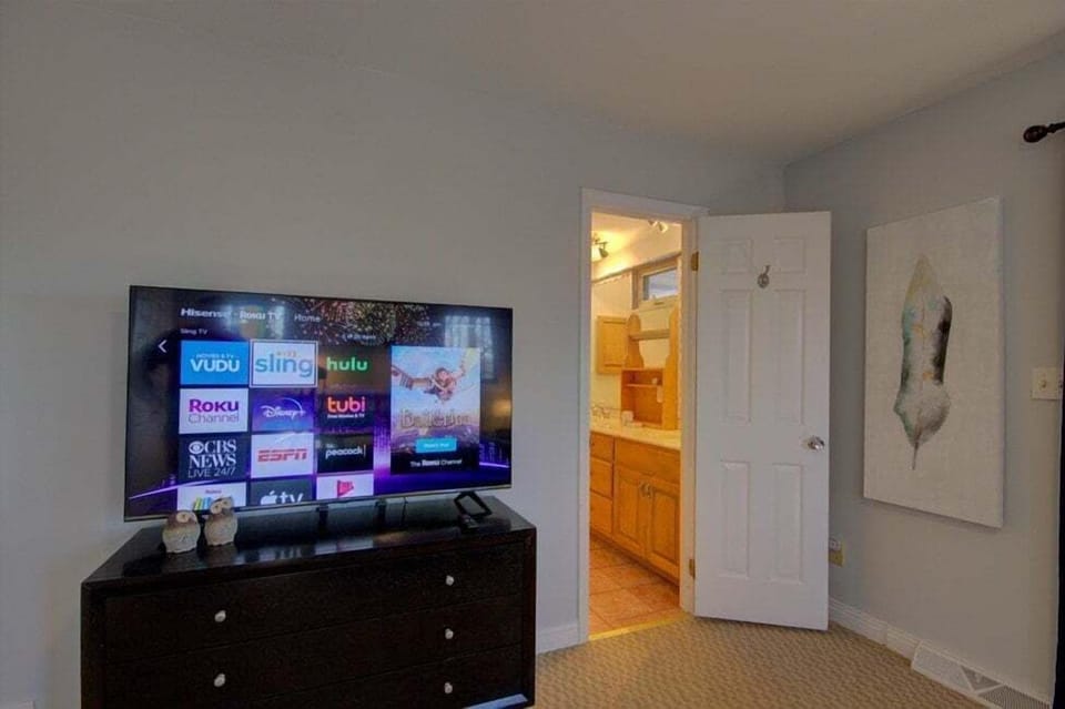 Big TV in master bedroom.