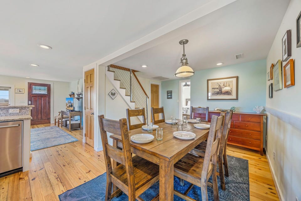 Gather around the rustic dining table where your group can enjoy memorable meals together in this warm, open-concept space.