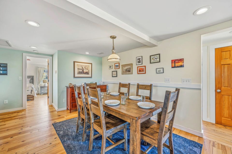 Gather around this rustic dining table where your group can share memorable meals together in this charming, art-filled space.