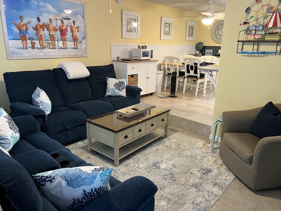 Relax in the living room with comfortable reclining sofas.