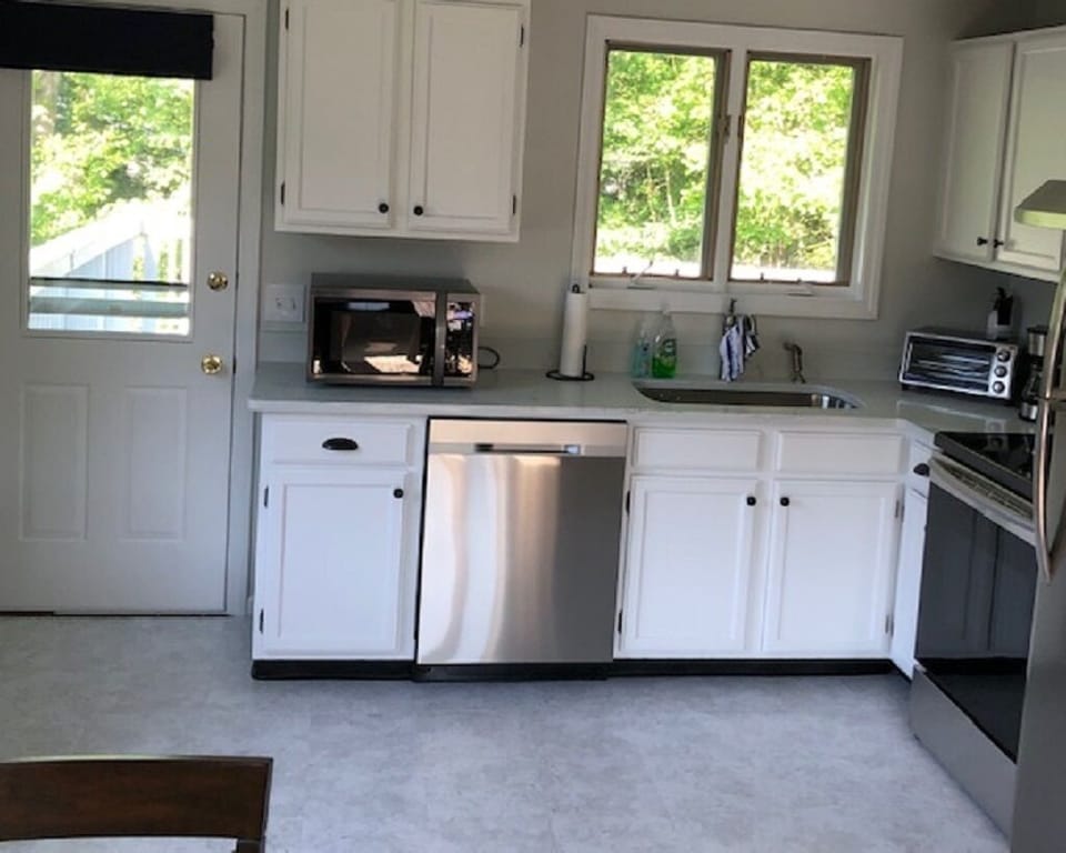Kitchen leading out to large private deck.