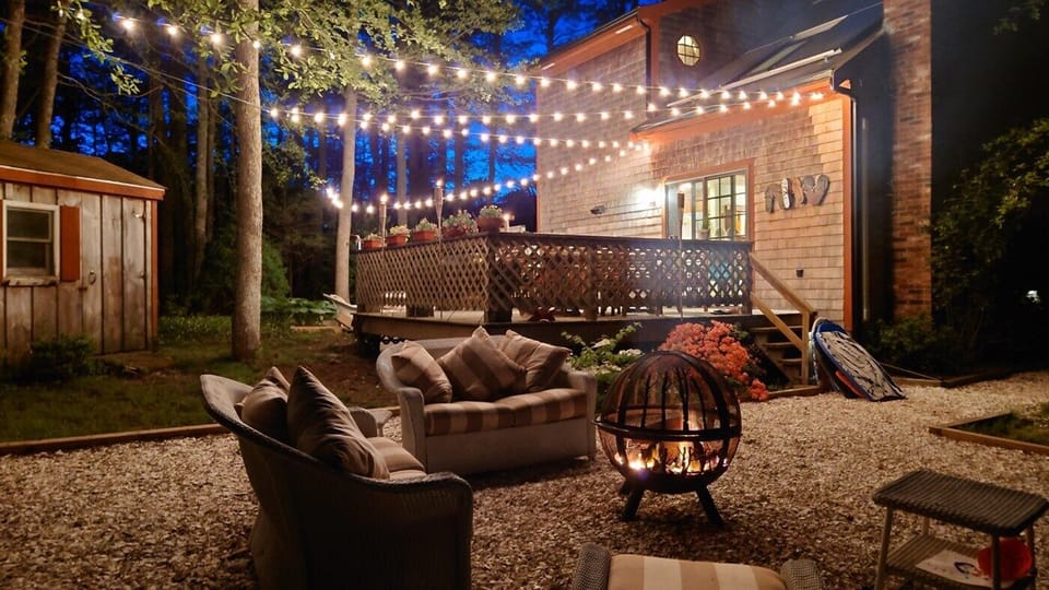 Relax on the deck or by the firepit after a day at the beach or biking