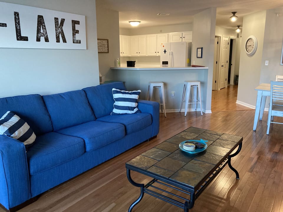 Living Area and Kitchen.  Full couch and loveseat.