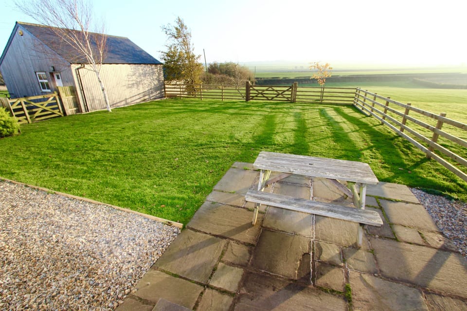View of garden from patio doors in Lounge Area