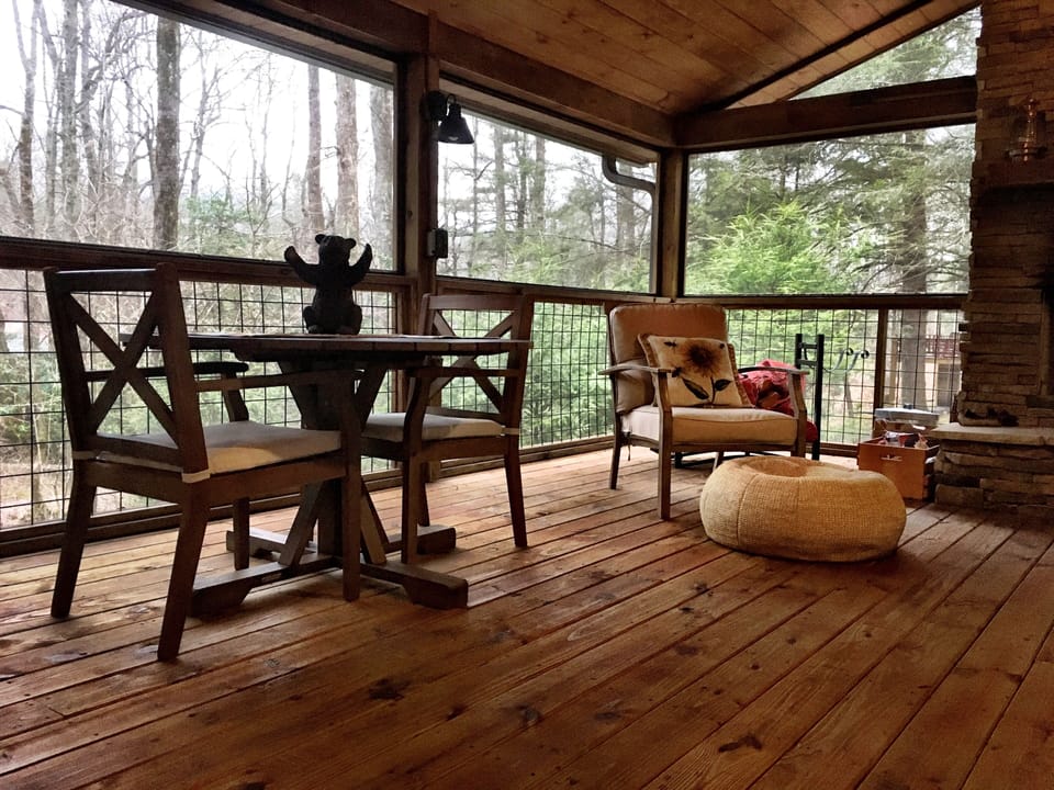 Outdoor eating in comfort with screened porch.
