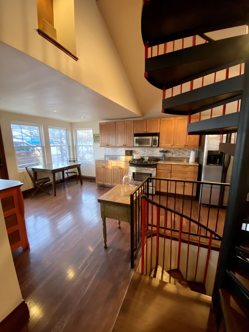 Kitchen and breakfast nook. Next to spiral staircase.  