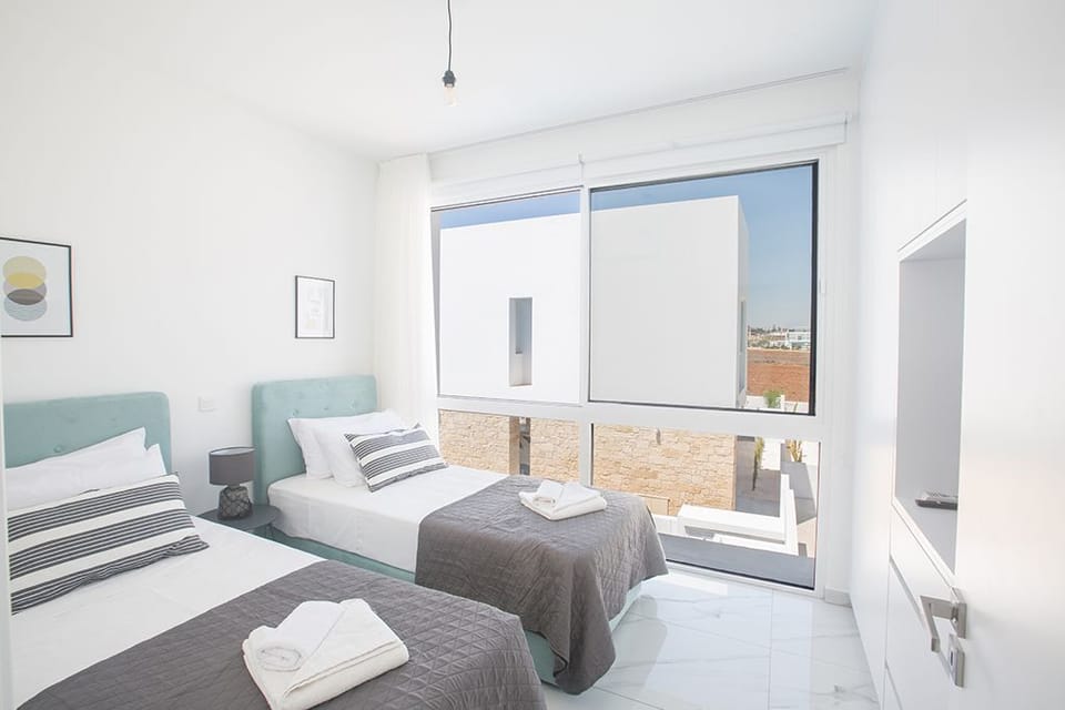 Bedroom 4 with two single beds and widescreen TV