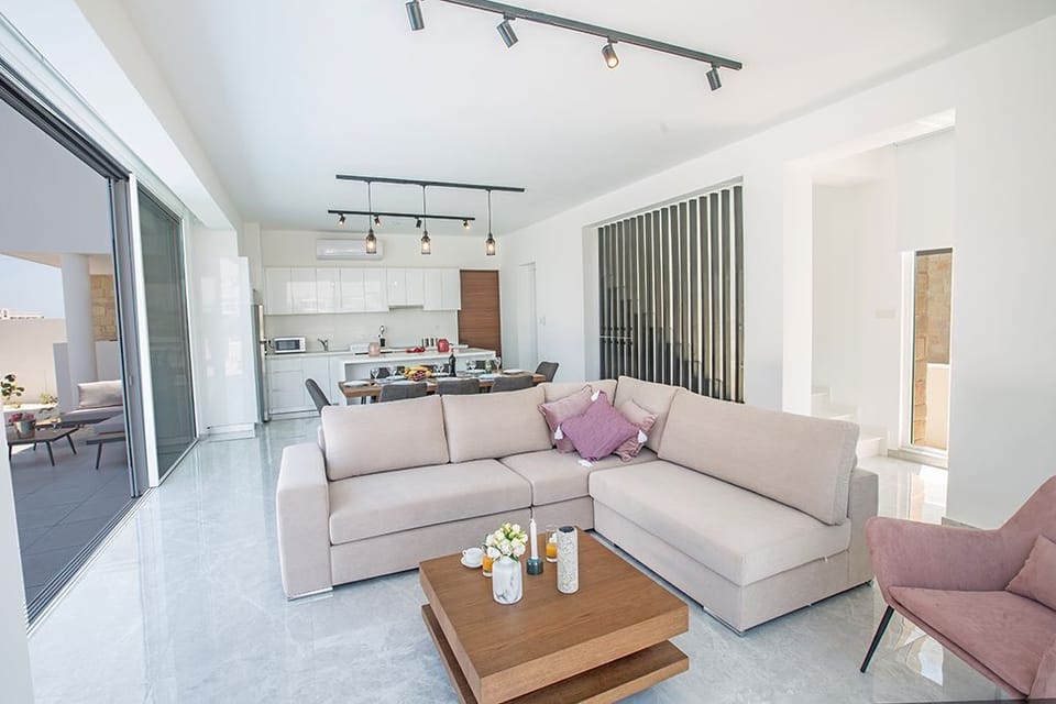 Living room with comfortable seating area, coffee table and Smart TV