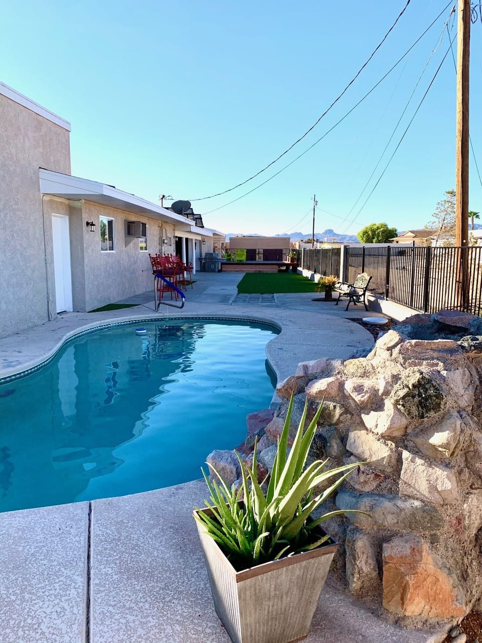 The huge backyard has a pool and deck, perfect for entertaining. 