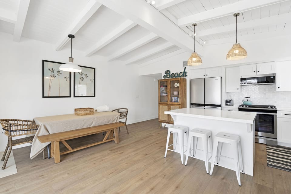 Upstairs - great dining space for 8 people plus kitchen island seats 3.  
