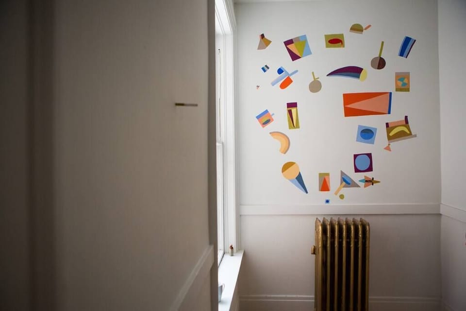 Our artists-in-residence are continually adding to our building. On the third floor landing, you'll find a mural by Kristin Texeira, a tiny installation by Langdon Graves, and a painting by Caris Reid.