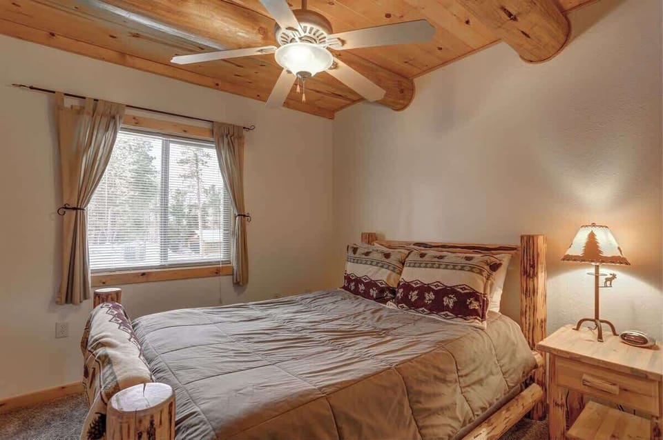 Main level bedroom with queen bed