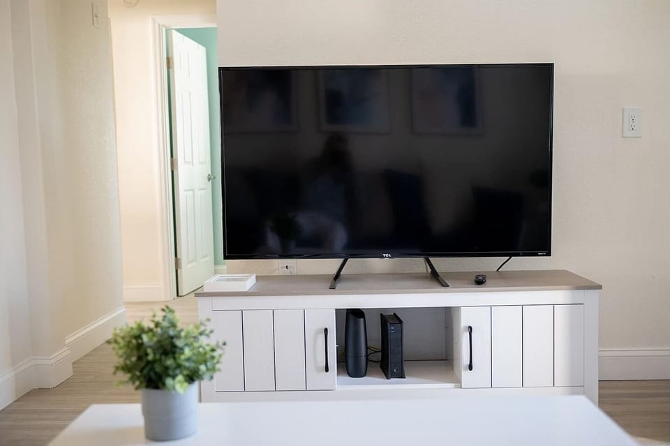 The living room boasts bright light and brand new flooring and furniture. There is a 53 inch television in the living room with Roku and high speed internet to access all your favorite apps and content.