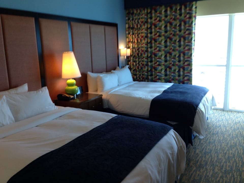 Guestroom with Two Queen Beds, closet, access to guest bath.