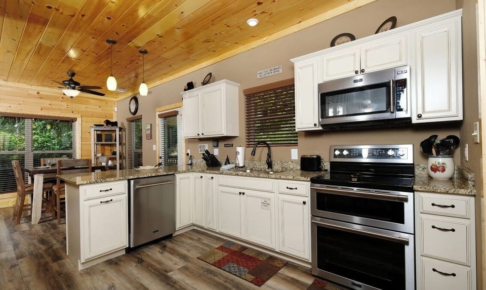 Full kitchen with granite countertops and stainless appliances