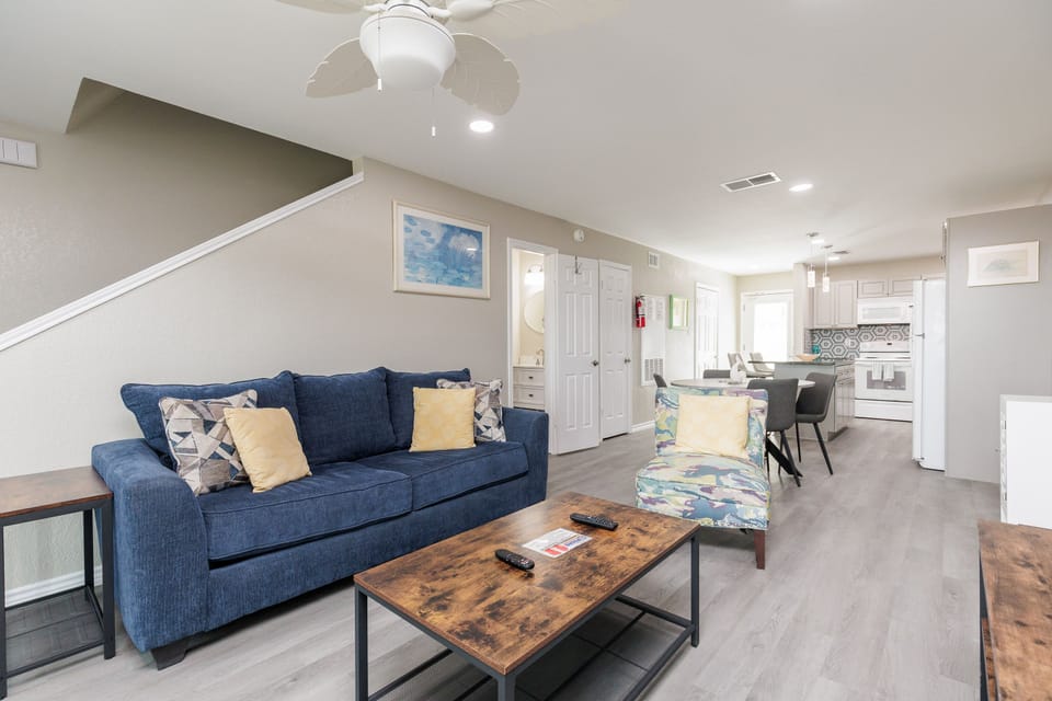 Relax in your spacious open-concept living area with comfortable seating, modern kitchen, and thoughtful touches that make you feel right at home.