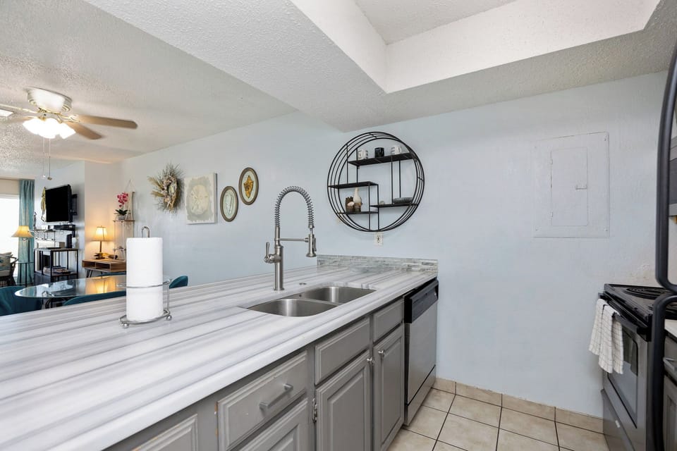 Your fully equipped kitchen offers marble countertops and modern appliances, perfect for preparing meals during your stay.