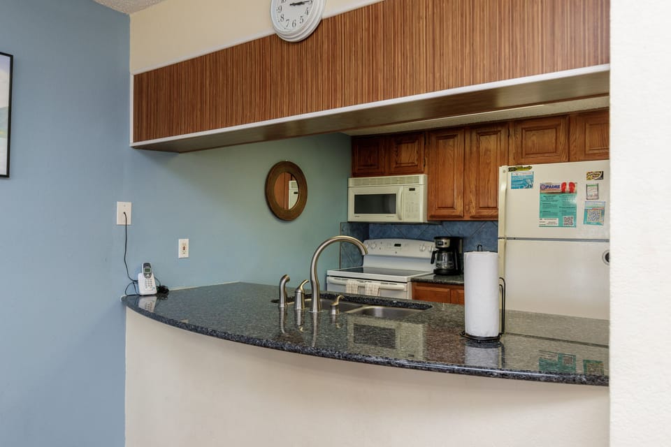 Your fully equipped kitchen features granite countertops, modern appliances, and everything you need to prepare meals during your stay.