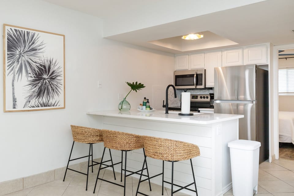 Your fully equipped kitchen features stainless steel appliances and a breakfast bar where you can start each morning with coffee.