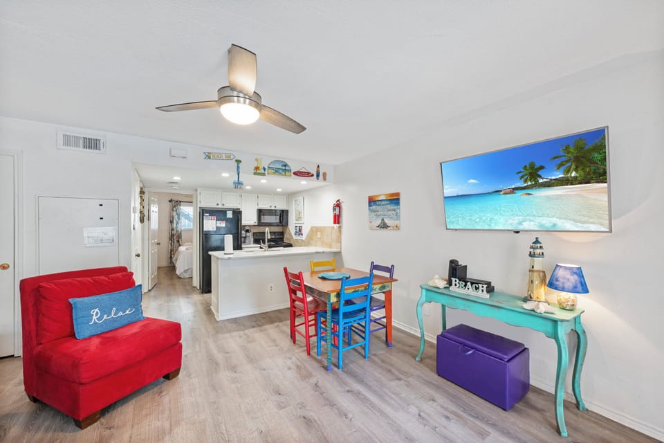 Unwind in your bright, cheerful living space with colorful furnishings and beach-themed touches that invite you to truly relax.