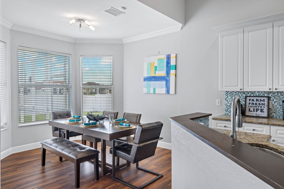 The dining area has a view of the backyard & pool