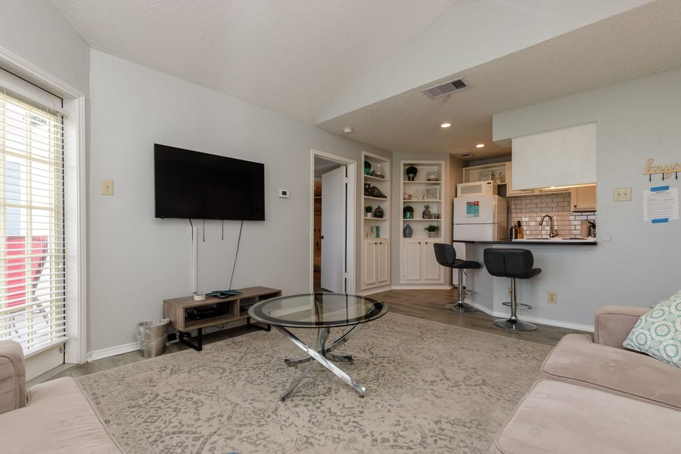 Unwind in your open-concept living space where modern comfort meets convenience. Watch your favorite shows while breakfast sizzles nearby.