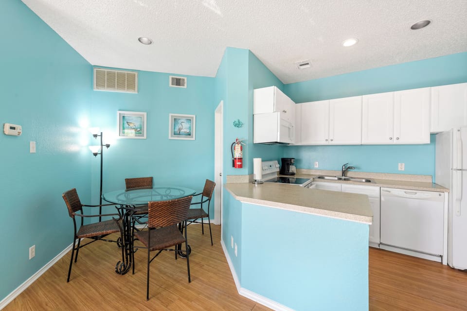 Whip up your favorite meals in this bright coastal kitchen with modern appliances and cheerful dining nook.