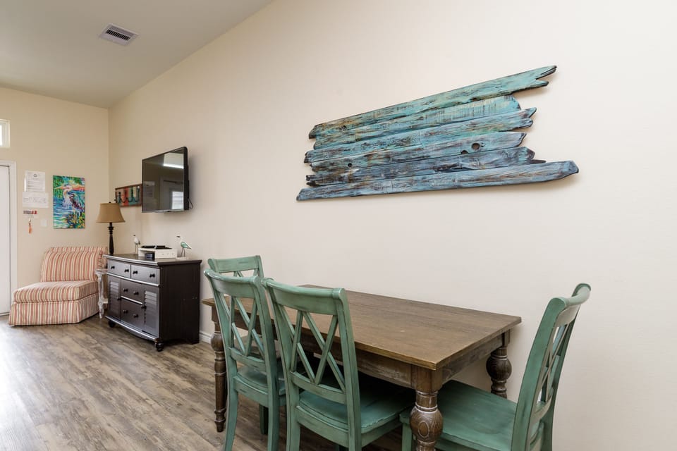 Gather around your coastal-themed dining table for memorable meals with loved ones in this charming space.