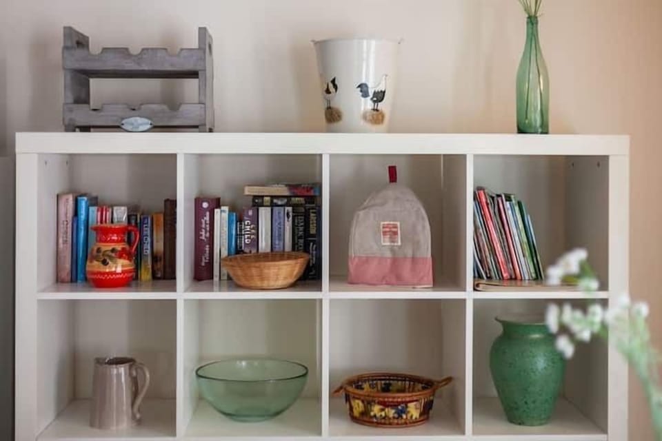 Part of the shelving unit on the dining/sitting area