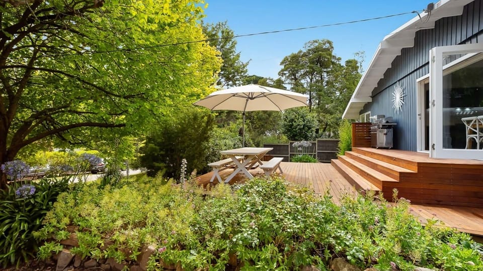 Blue Beachside Outdoor Entertainment Area with BBQ