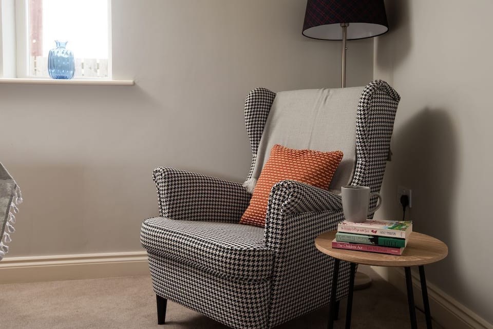 Farm Cottage - the high-backed armchair is perfect for enjoying time with a good book