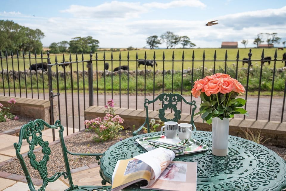 Farm Cottage - enjoy a cup of tea in the front patio garden, whether basking in the summer sun, wrapped up on a crisp autumn morning, under the gentle warmth of spring, or watching winterâ€™s frost glisten