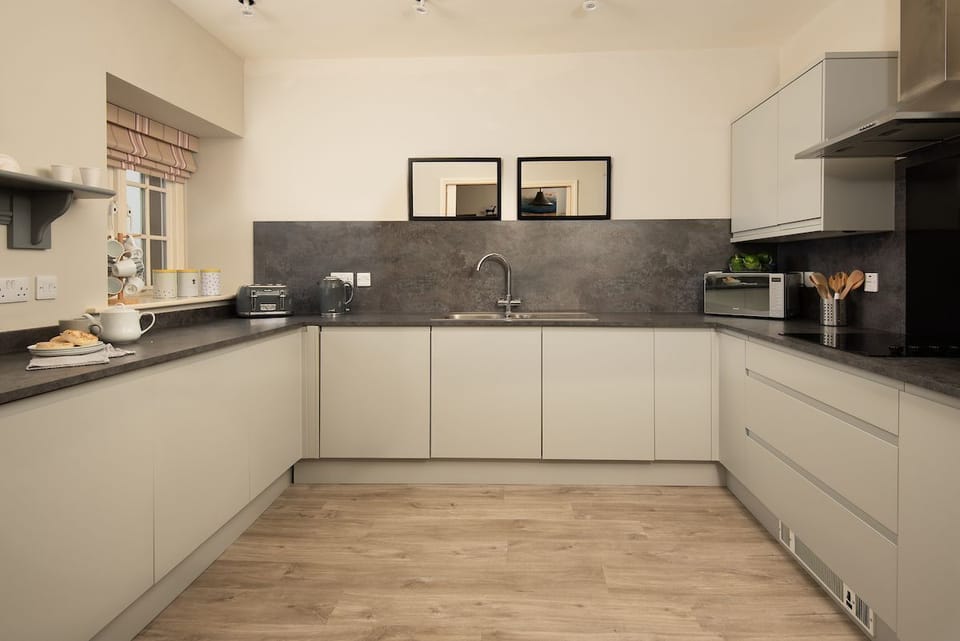 Farm Cottage - the kitchen with smart integrated units and storage space