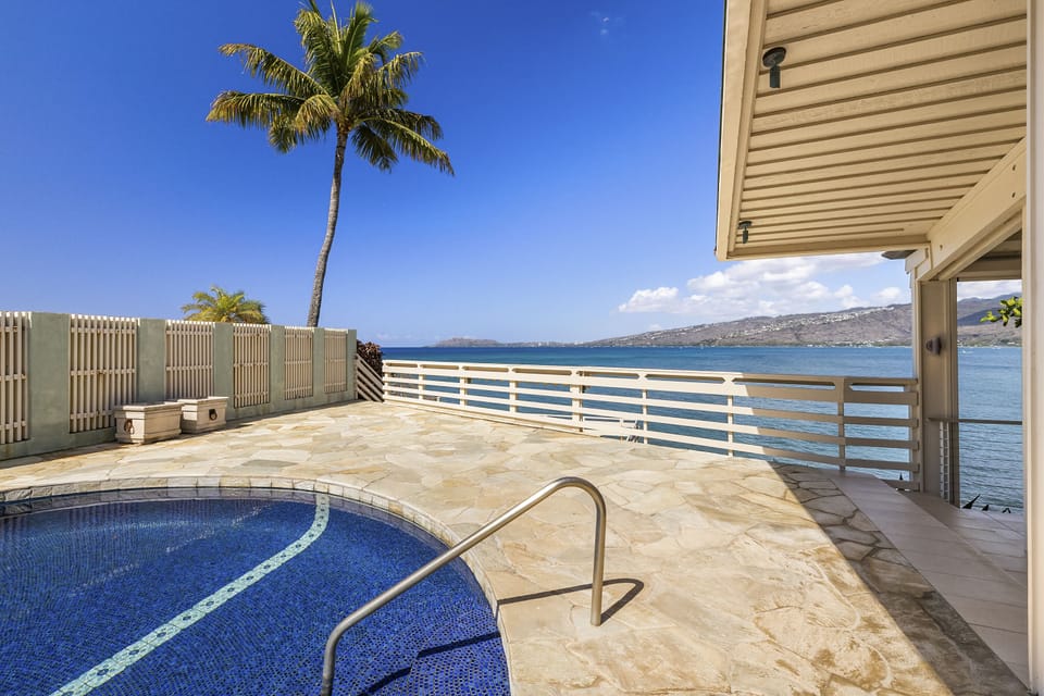 Relax in the private pool while enjoying unobstructed views of Maunalua Bay with Diamond Head in the distance.