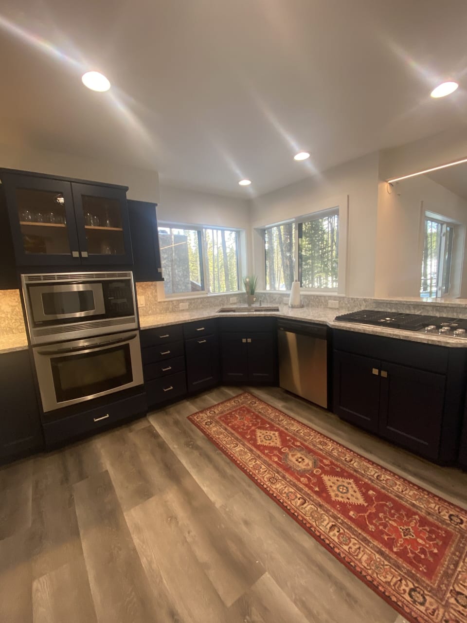 Modern kitchen with gas cooking. Remodeled 2022. Floors, countertops and more.