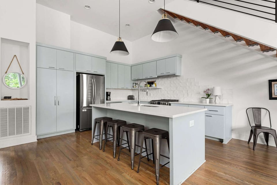 Kitchen features coffee pot, french press, tea kettle, and plenty of wine glasses!