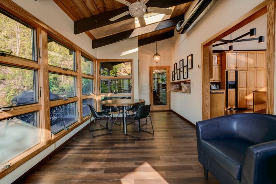 Sunroom with Breakfast Table overlooks Back Deck
